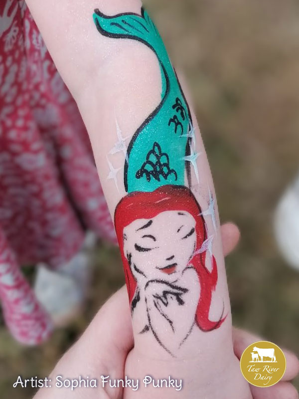 Little mermaid painted on arm by Sophia Funky Punky at Taw River Dairy Open Day Cher's Funky Faces