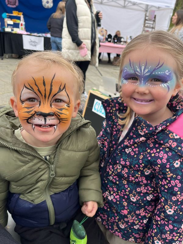 Boy Tiger face paint and girl Snow Princess face paint by andrea funky punky chers funky faces