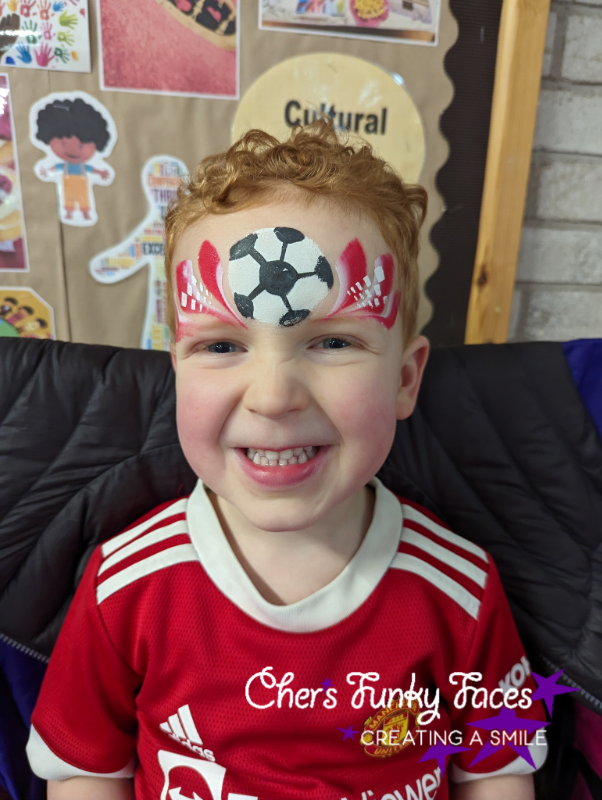 Football in Man U colours