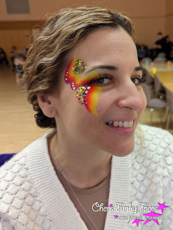 Adult festival and glitter design around one eye chers funky faces