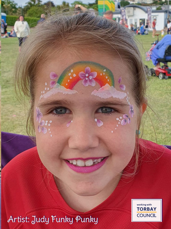 Rainbow-by-judy-funky-punky-at-Torbay-s-Queens-jubilee-celebrations-with-chers-funky-faces