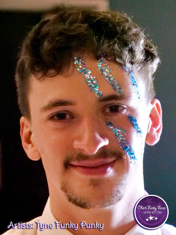 Student with biodegradable glitter in 3 stripes over his eye by chers funky faces
