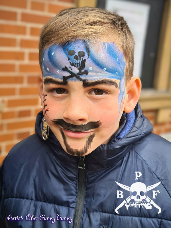 Blue bandana, eye patch, moustache, beard and scar face paint by cher funky punky at Brixham pirate festival 