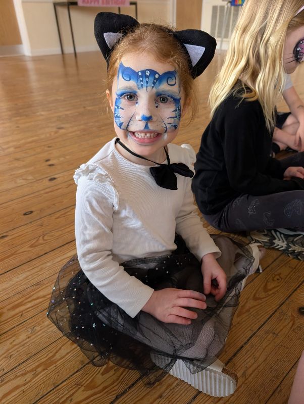 Blue swirly cat face paint by cher funky punky