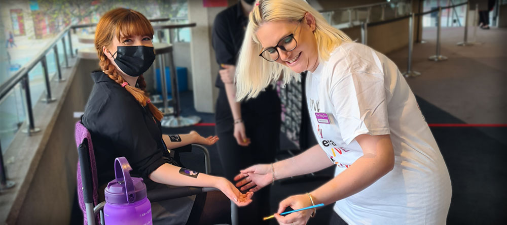Kaylie-funky-punky-applying-glitter-tattoo-at-Welsh-national-opera-event-theatre-royal-plymouth.jpg