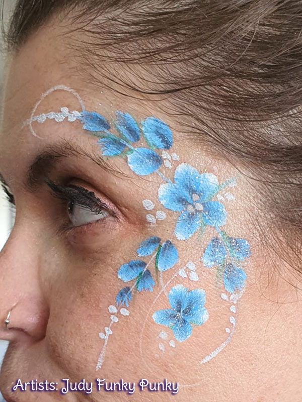 Blue flowers by Judy Chers Funky Faces for Plessey Semiconductors family day