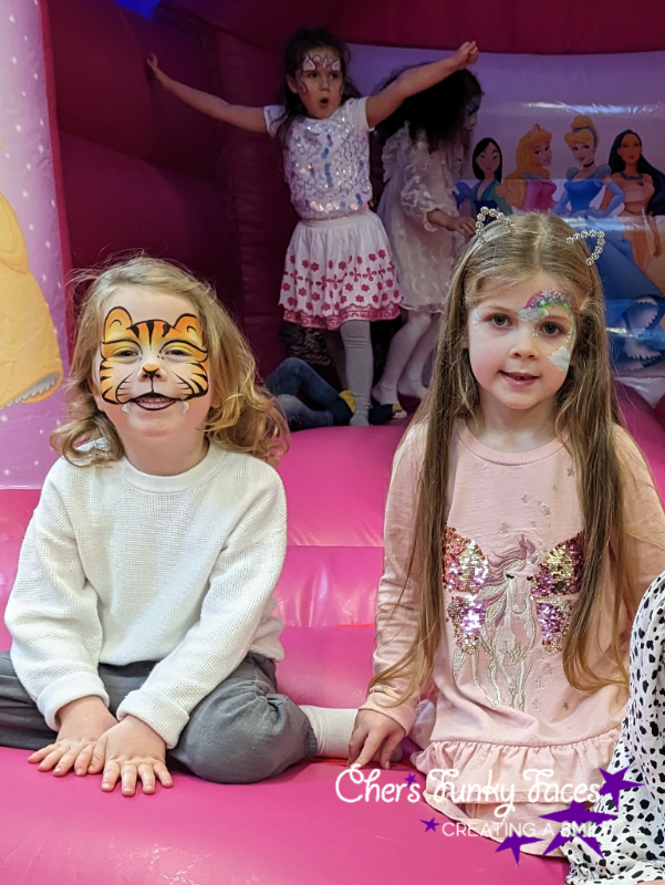 tiger and rainbow face paint with unicorn in the background chers funky faces .png