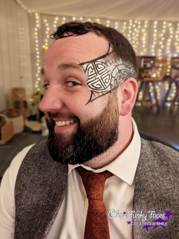 Male festival style face paint at wedding reception Trevenna Chers Funky Faces
