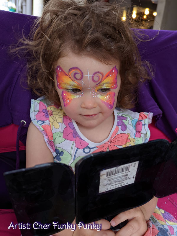 Neon-Butterfly-at-Winchester-Hat-Fair-by-Chers-Funky-Faces